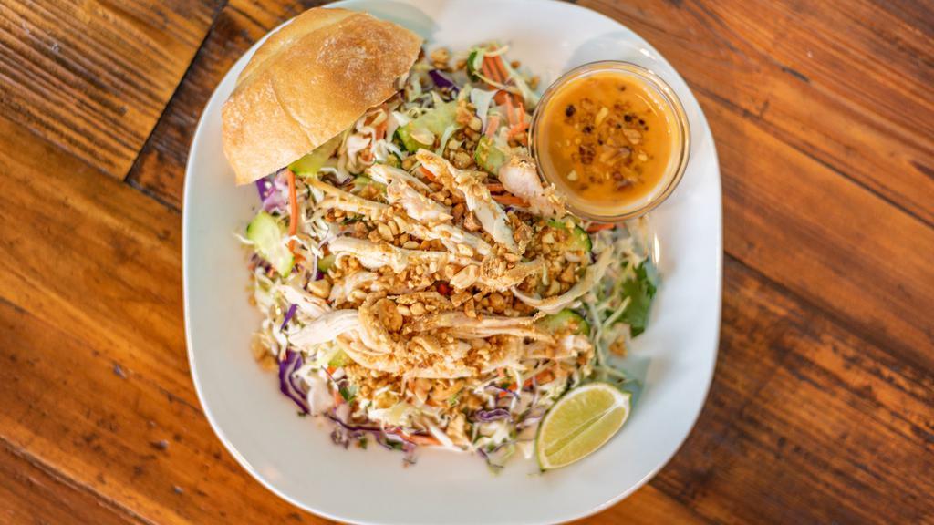Thai Chicken Salad · Fresh cabbage, Thai basil, cilantro, shredded carrots, served with roasted peanuts and home made peanut sauce.