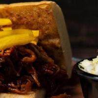 Regular Squealin Pig · Slow cooked pulled pork in our Spicy BBQ sauce. Served with your choice of side.