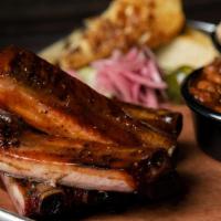 Half Rack Rib Meal · A half rack of our St. Louis style pork ribs. .  Served with your choice of two sides and br...