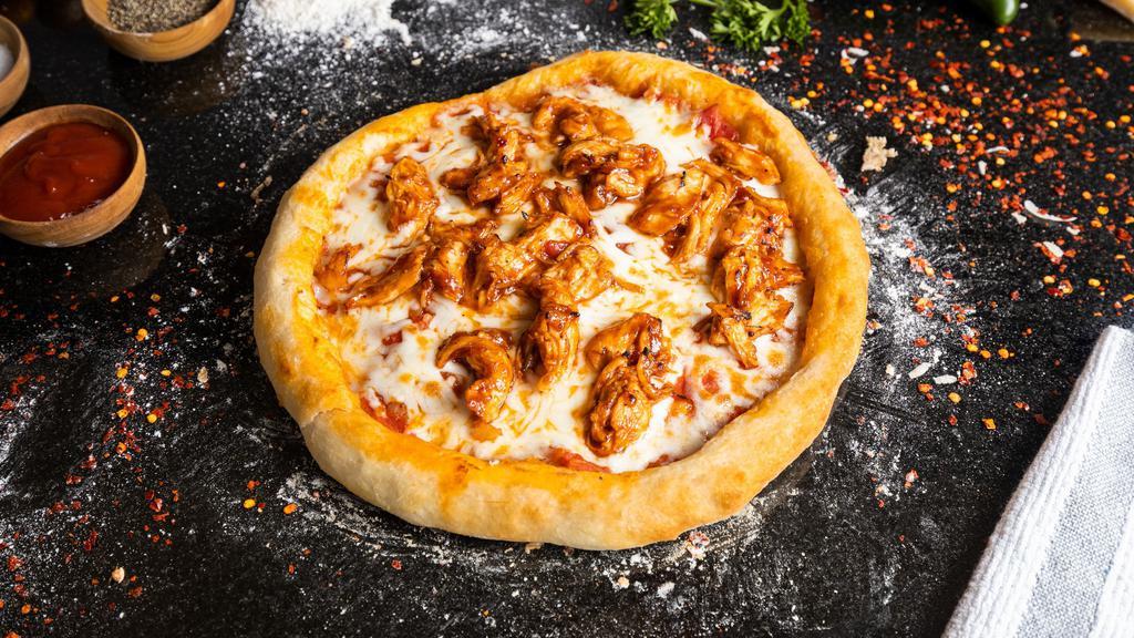 BBQ Chicken · Juicy chicken breasts, red onions, tomatoes, mozzarella, and BBQ sauce cooked on our homemade pizza dough.
