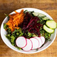Kale Slaw · Kale, carrots, pickled onions with a house-made creamy dressing.