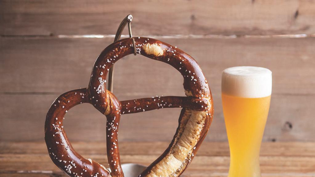 German Pretzel · A WOB original and tavern favorite. A giant Bavarian pretzel baked soft on the inside, crispy on the outside, and salted. Served with housemade stone ground mustard.