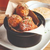 Mac 'n Cheese Bites · Pasta shells and spiced pepper jack cheese sauce, coated in bread crumbs, and fried crispy. ...