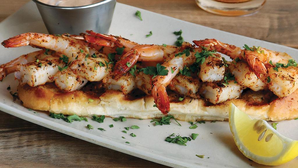 CHAR-GRILLED SHRIMP · Boldly marinated shrimp char-grilled & served on grilled garlic bread with house-made remoulade sauce.