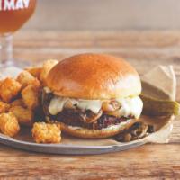 Chimay Burger · Fresh Angus Beef burger piled high with chimay classique cheese, sautéed mushrooms, and cara...
