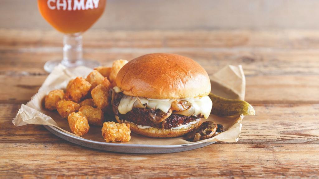 Chimay Burger · Fresh Angus Beef burger piled high with chimay classique cheese, sautéed mushrooms, and caramelized onions. Served on a brioche bun with housemade chimay sauce.