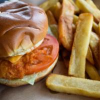 Crispy Buffalo Chicken Sandwich · Lightly hand breaded beer brined chicken breast tossed in spicy buffalo suance & topped with...