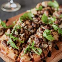 Black & Blue Steak Flatbread · Blackened steak, caramelized onions, and mushrooms, mozzarella and blue cheeses, finished wi...