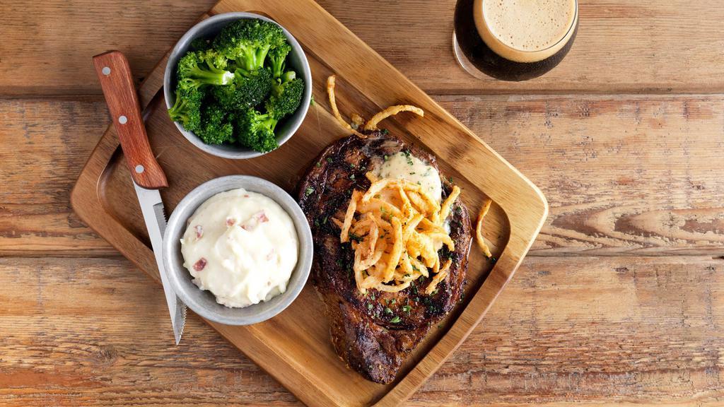 Ribeye · 12 oz. USDA Choice Ribeye seasoned & grilled topped with Stout butter & fried
onions, served with fries & steamed broccoli