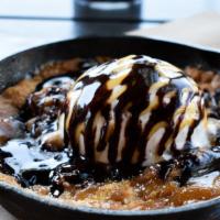 Salted Caramel Cookie Skillet · Fresh out of the oven salted caramel almond cookie, topped with vanilla bean ice cream and d...