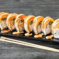 SARA ROLL · Raw.Huge Sara roll stuffed with crab meat,four tempura shrimp,cucumber, covered with salmon,...