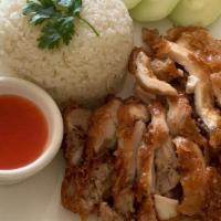 Fried Khao Mun Gai · Fried chicken over rice with sweet sauce.