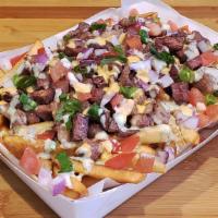 Original Pork Sisig Fries · Pork Sisig, House Sauces, Diced Tomato, Diced Red Onions and Green Onions o/ Bed of Crispy F...