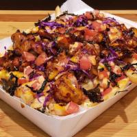 Korean BBQ Chicken Fries · Pan Fried Chicken, House Korean Sauce, Diced Tomatoes, Red Cabbage, and Seaweed Flakes o/ Be...