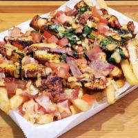 Southwest BBQ Chicken Fries · Chicken Breast, BBQ & Ranch Sauces, Diced Tomatoes and Spinach, o/ Bed of Crispy Fries.