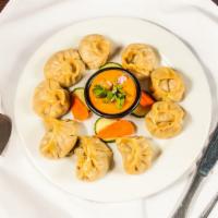 Mixed Momo (9 Pieces) · Steamed dumplings filled with minced lamb, onion, garlic, ginger, and cilantro. Consists of ...