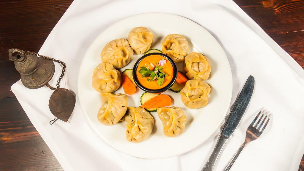 Mixed Momo (9 Pieces) · Steamed dumplings filled with minced lamb, onion, garlic, ginger, and cilantro. Consists of each 3 pieces of chicken, lamb and veg. Momo. Served with tomato chutney.