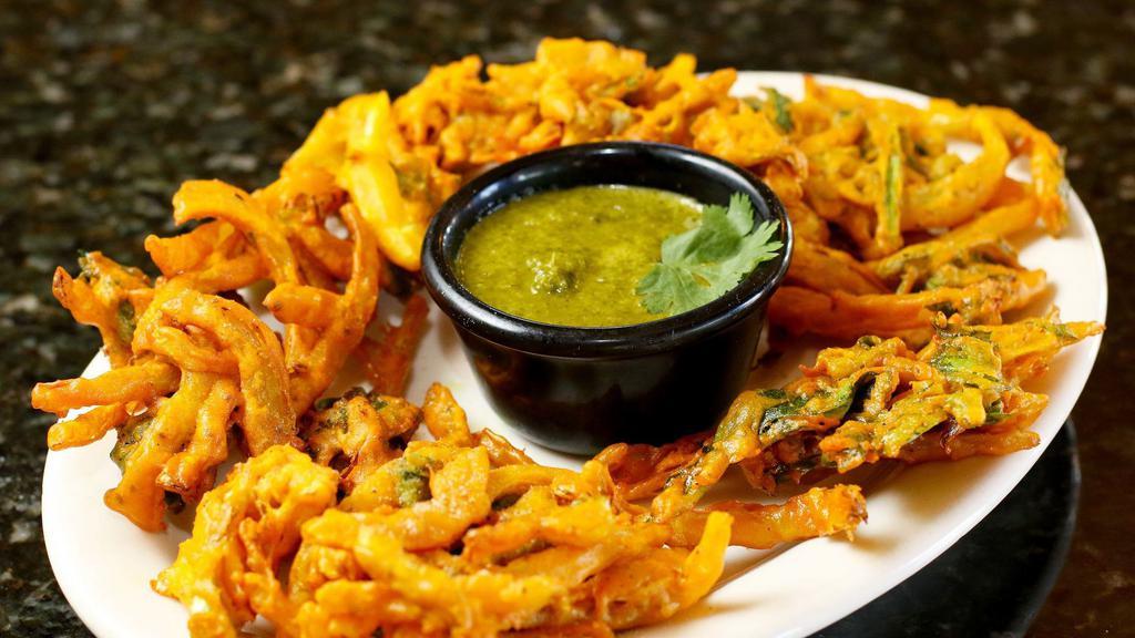 Veg. Pakora (5 Pieces) · Vegan. Mixed golden-fried vegetable fritters. Served with mint sauce.