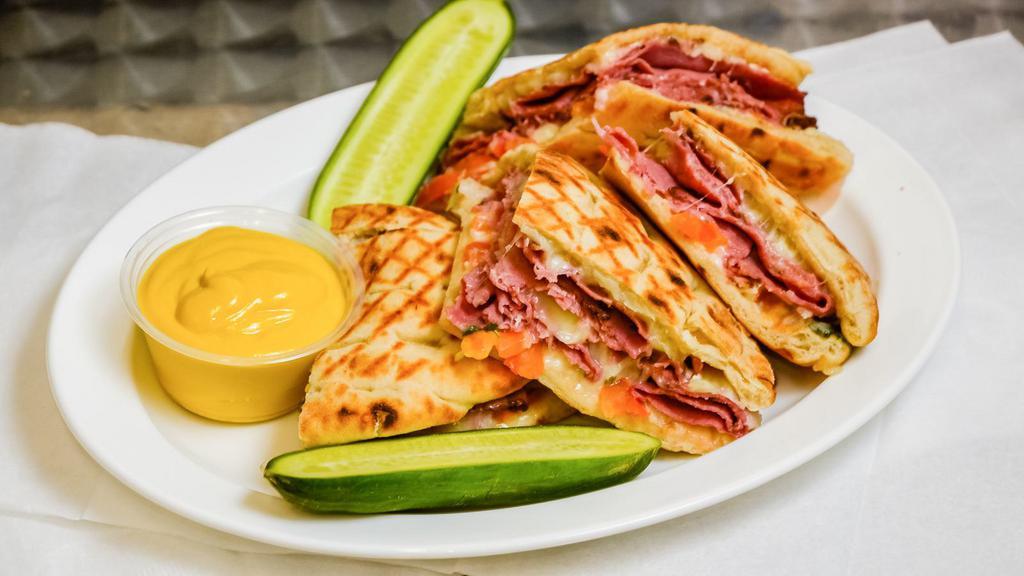 SPICY    PASTRAMI   · Seasoned Beef Pastrami Meat On Pita Bread With Jalapenos - Tomatoes - Onions - - Mozzarella Cheese - Spicy Sauce