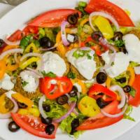 FALAFEL  SALAD · Falafel Balls  .Lettuce, tomatoes, onions, sliced olives, cucumbers, peppers, carrots  tzatz...
