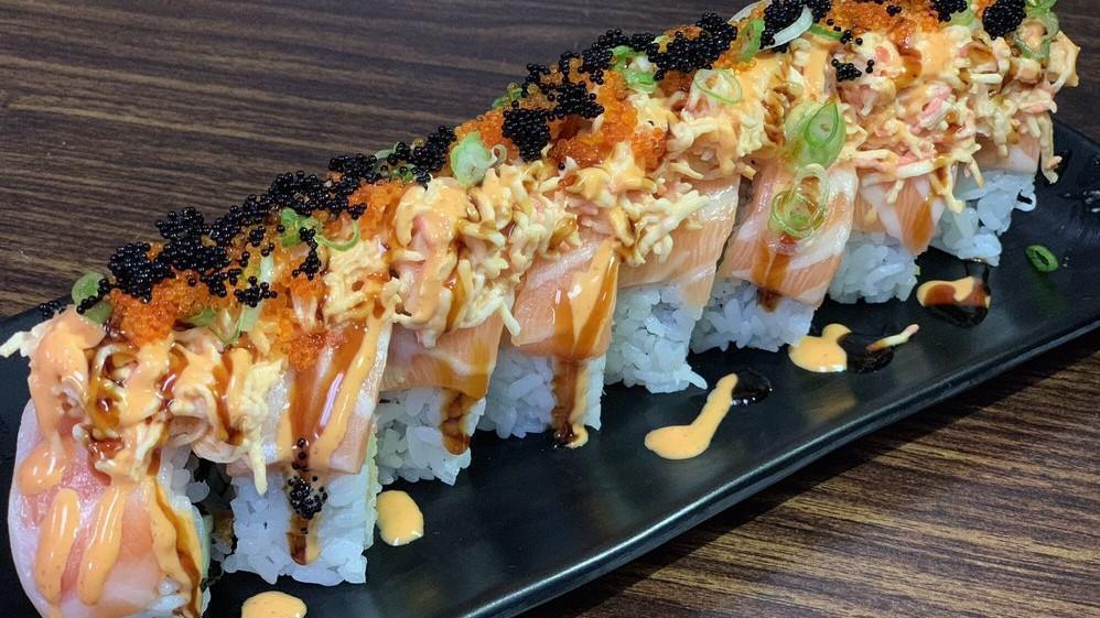 Wow Roll · Eight pieces.Shrimp tempura, cucumber top with salmon, spicy crab, spicy mayo, unagi sauce, tobiko, and scallion.