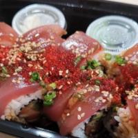 cherry blossom · 8pc salmon, avocado inside/ tuna outside with green onion ,tobiko, sesame seeds and unagi sa...