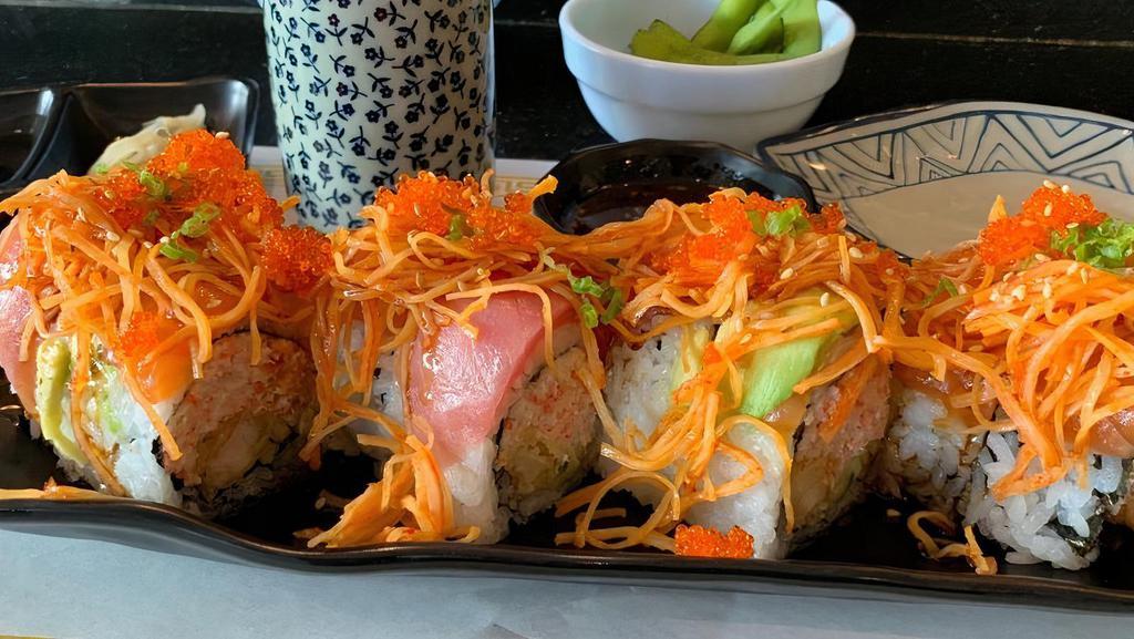 Titanic Roll · Shrimp tempura wrapped with salmon and tuna topped spicy crab meat, avocado and green onion, tobiko.