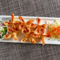 Crab Rangoon · Crispy, filled with Dungeness crab meat, celery, imitation crab, and cream cheese.