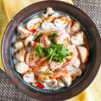 Tom-Kha Soup · Coconut milk soup with mushrooms, cilantro, kaffir lime leaves, and galangal.