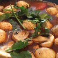 Tom-Yum Soup · Spicy and sour soup with mushrooms, tomatoes, lemongrass, galangal, cilantro, and kaffir.