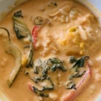Pumpkin Curry · Simmered in red curry paste with coconut milk, kabocha squash, bell peppers, and basils. Ser...