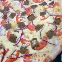 Gyro Pizza · Gyro, tomato, onion, tzatziki sauce. Cilantro. only large size.