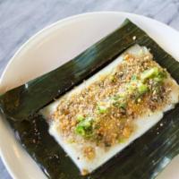 Banh Nam · A steamed rice dumpling wrapped in banana leaf, ground pork, dried shrimp, garlic, fish sauc...