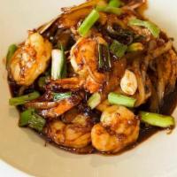 Caramelized Gulf Shrimp · Wild gulf shrimp, stir fried in the wok with chili sate, garlic, red onion, in a chili caram...