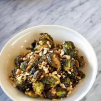 Brussel Sprouts, chili caramel sauce, crushed roasted cashews · Fried crispy brussel sprouts, tossed with a chili caramel sauce, and topped with crushed roa...