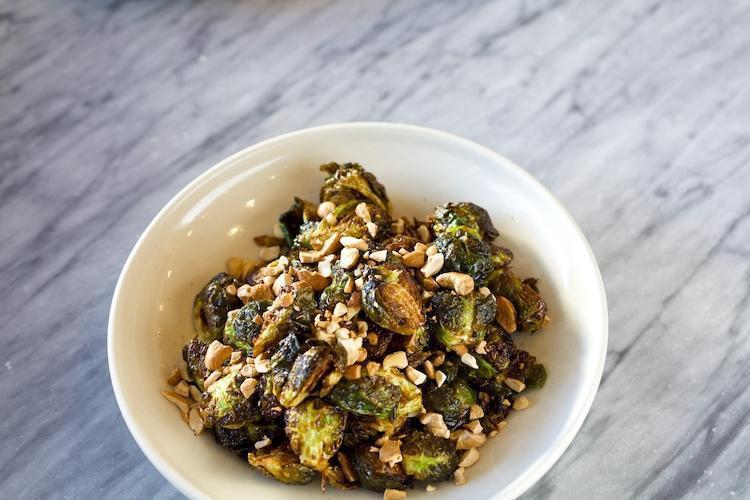 Brussel Sprouts, chili caramel sauce, crushed roasted cashews · Fried crispy brussel sprouts, tossed with a chili caramel sauce, and topped with crushed roasted cashews. *gluten free
