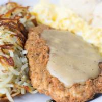 Chicken Fried Steak · Breaded beef cutlet smothered in poultry gravy. Served with 2 eggs any style, potatoes or gr...