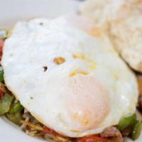 Eggs in a Tasty Nest · Two eggs nestled in a bed of hash browns with bacon, grilled green peppers, fresh tomatoes, ...