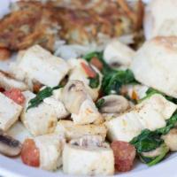 Vegan Delight · Tofu sauteed with mushrooms, tomato, fresh spinach and garlic with spices.