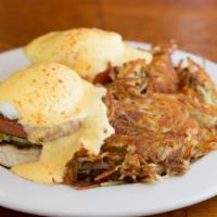 Eggs Benedict · Ham served on English muffin, poached eggs with hollandaise sauce and hash browns.