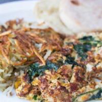 Nadias Vegetarian Scramble · Eggs, onions, mushrooms, fresh spinach, Jack cheese, fresh salsa and spices with red beans o...