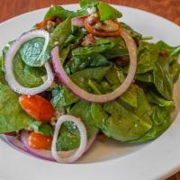 Spinach Salad · Tossed in a light vinaigrette dressing with bacon, blue cheese crumbles, walnuts, red onions...