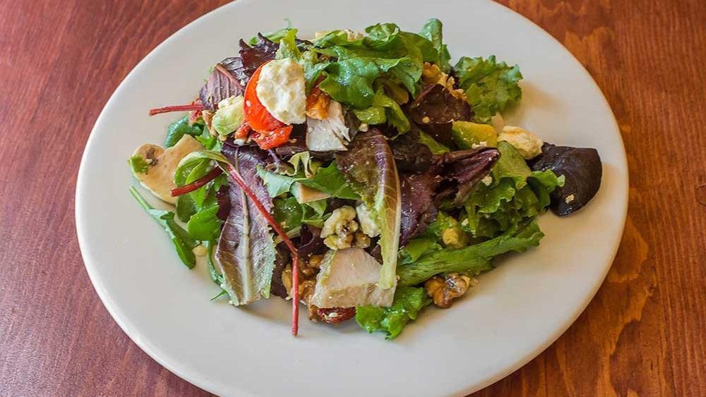Palm Deluxe Salad · Mixed greens with sundried tomatoes, feta cheese, turkey breast, avocado, walnuts, cherry tomatoes and mushrooms tossed in Italian dressing.