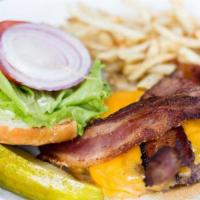 Bacon Cheeseburger · 8oz beef patty hickory smoked bacon, sharp cheddar, . Served on brioche buns with tomato, le...