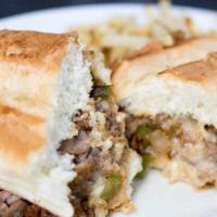 Philly Cheese Steak Sandwich · Sliced rib eye steak (or diced chicken) grilled with bell pepper, onions and Jack cheese ser...