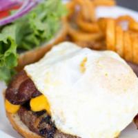 Egg Burger · Beef patty topped with over medium egg, bacon, garlic aioli, sharp cheddar, all-natural beef...