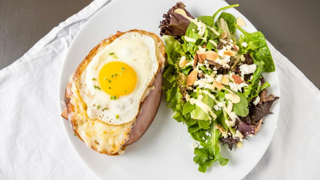Croque Madame · French ham, Swiss cheese, mozzarella cheese, chives and mix spring salad.