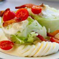 Wedge Salad · crisp iceberg, bleu cheese, warm bacon lardons, tomatoes, hardboiled egg, creamy bleu cheese...