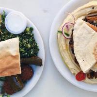 Mediterranean Plates · Served with hummus, tabouli, babaghanous, dolmas, and two falafels.