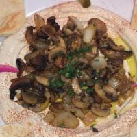 Hummus with Mushroom · A plate of hummus topped with sauteed mushrooms and onions.